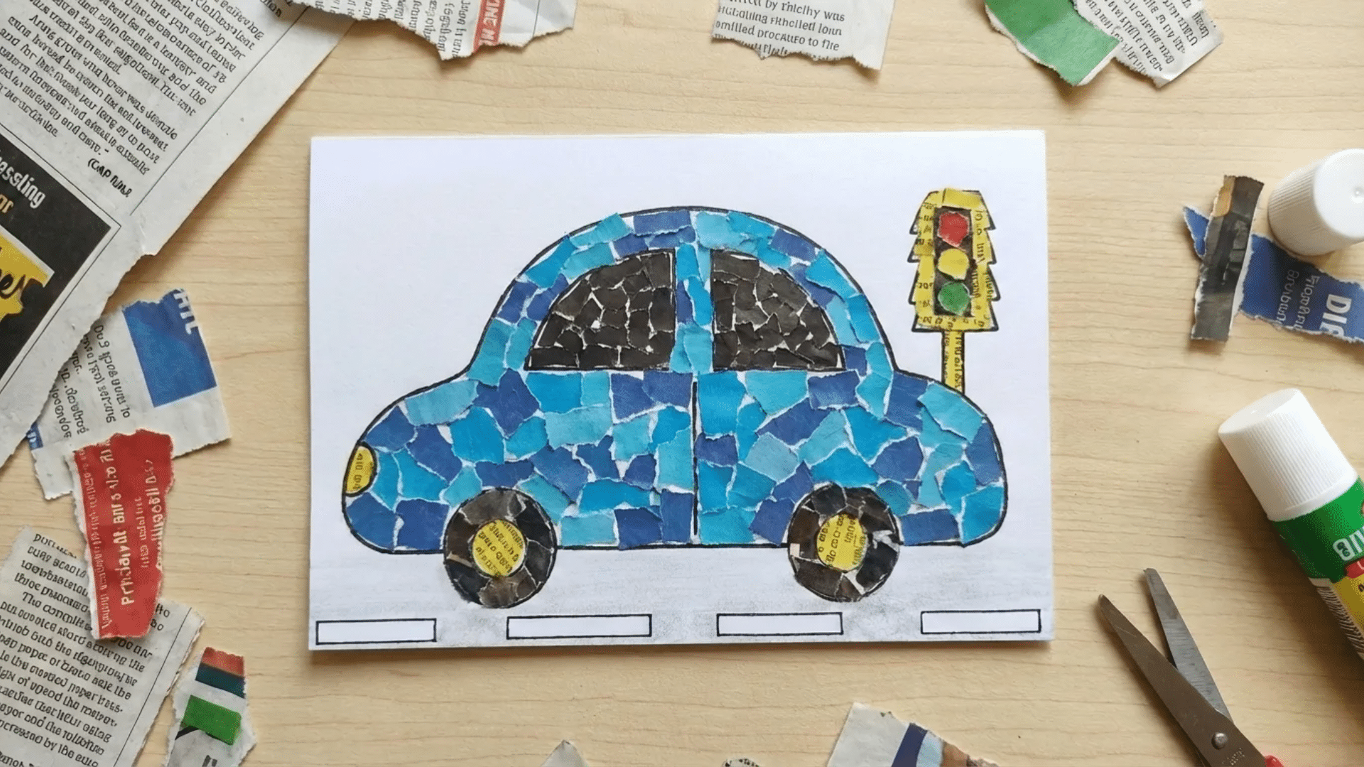 a simple blue car built from layered torn newspaper and magazine pieces on white cardstock