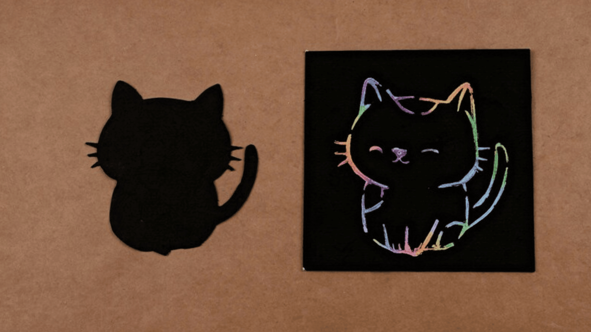 black cat silhouette on the left and a vibrant, colorful chalk drawing of a happy cat on the right, on a craft surface