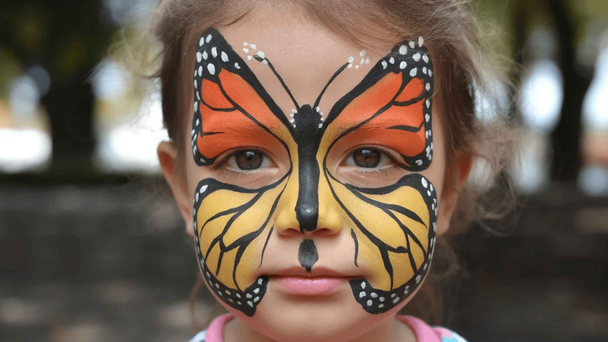 buttterfy face paint on a girl