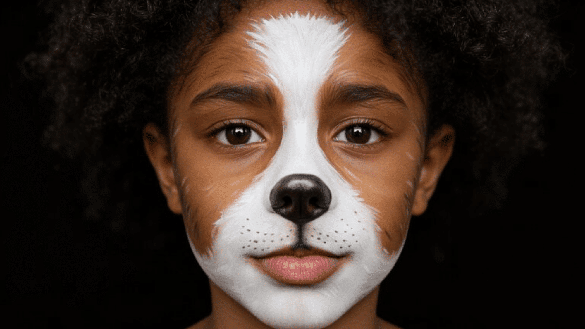 close-up of a real kid with dog face paint, no hands visible, vivid brown and white muzzle detail
