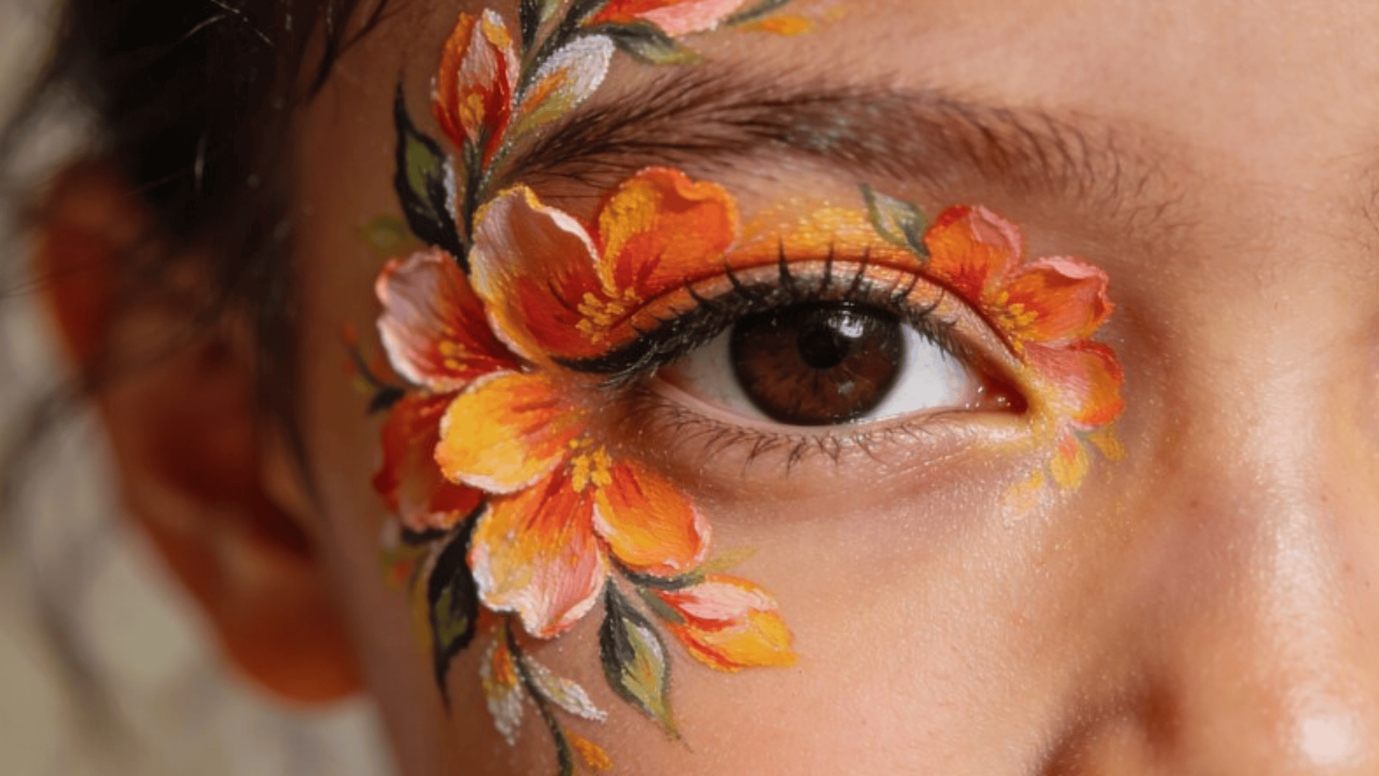 close-up of a real kid's face painted with detailed floral designs, bright petals around eyes, no hands visible