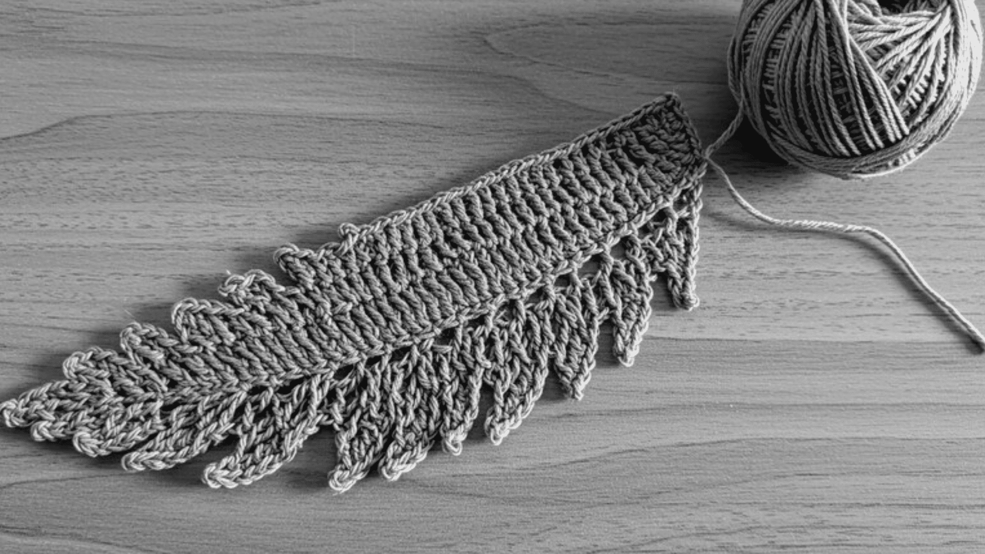 feathered crochet border in grey yarn