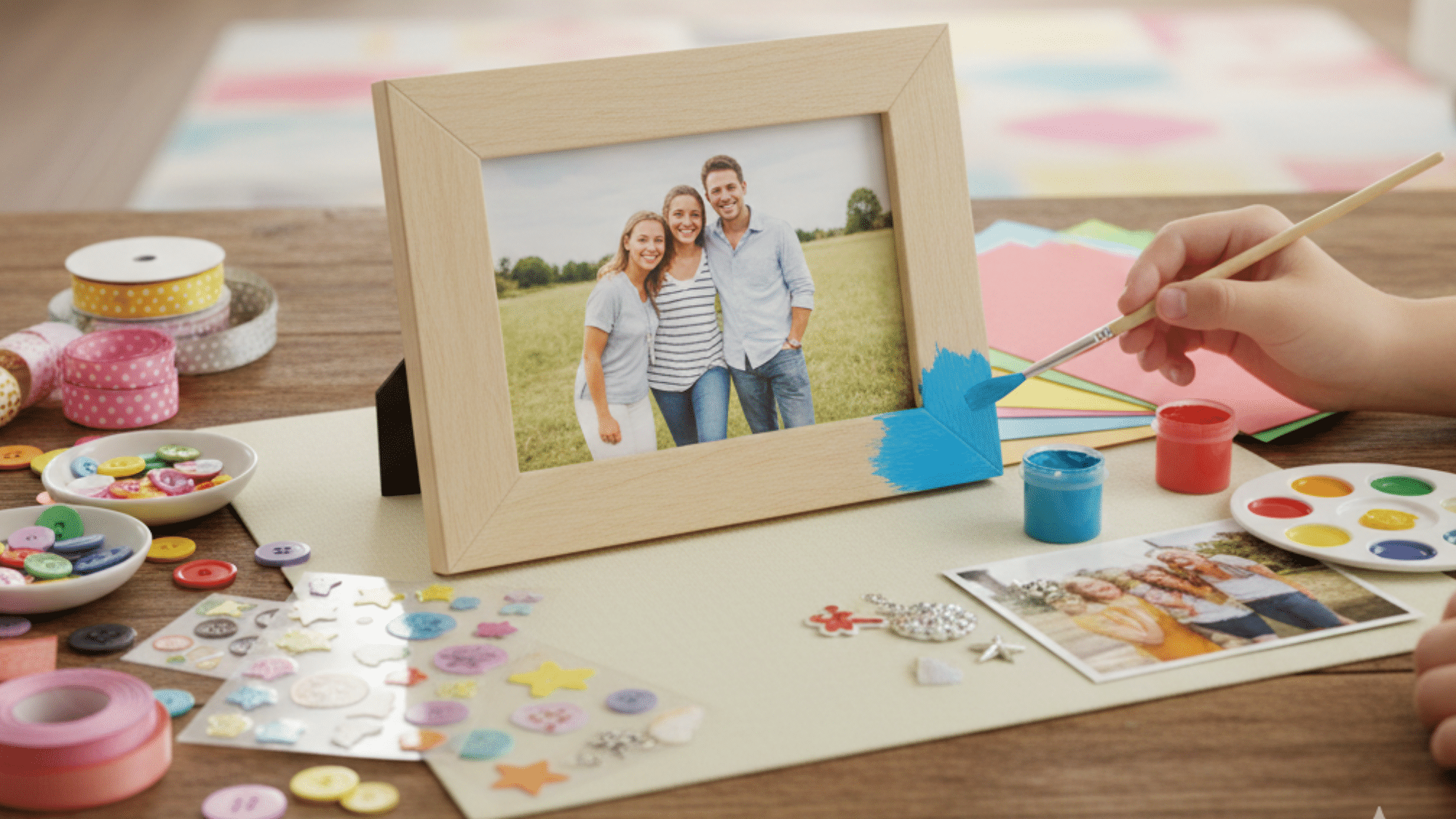painting a custom photo frame with family picture and craft supplies