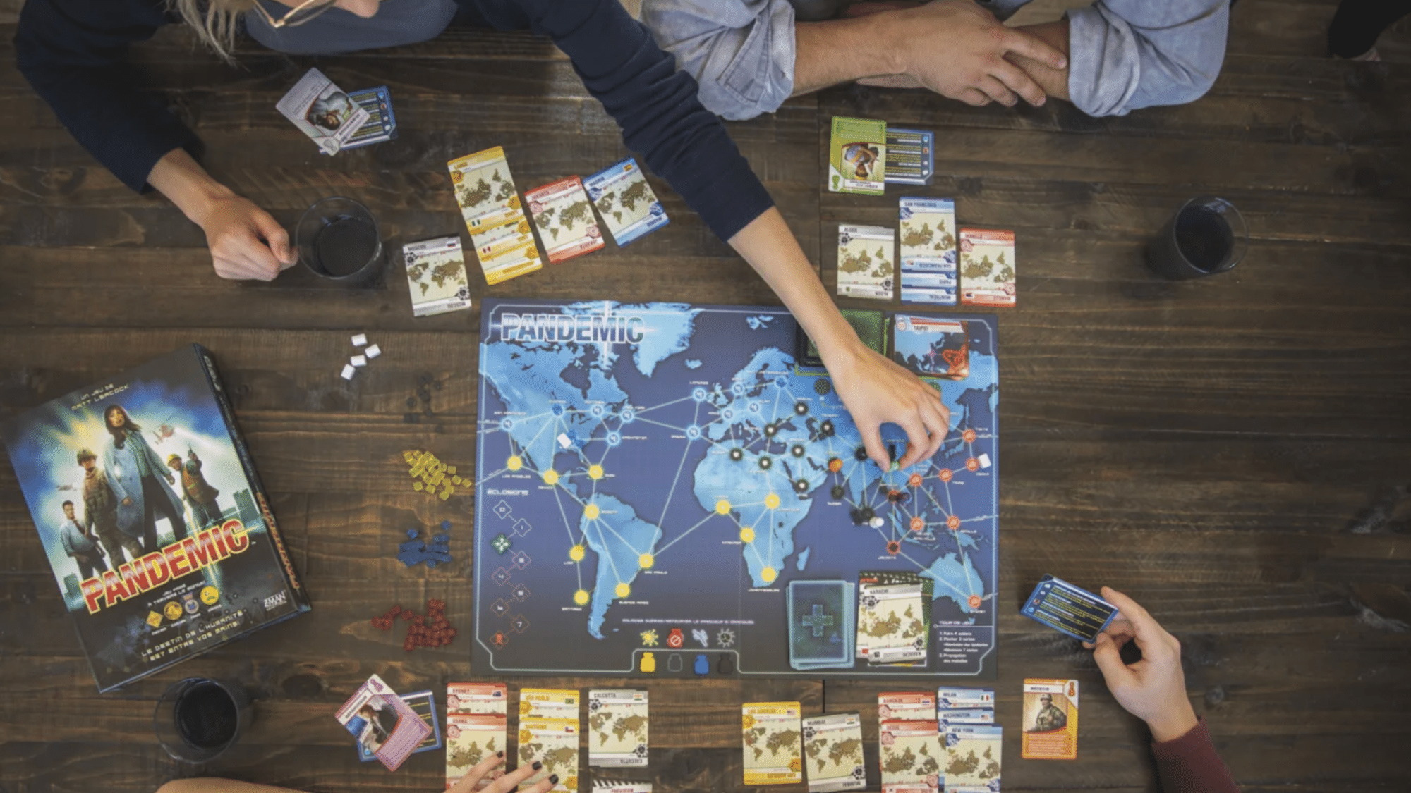 pandemic cooperative board game with players managing disease outbreaks on a world map