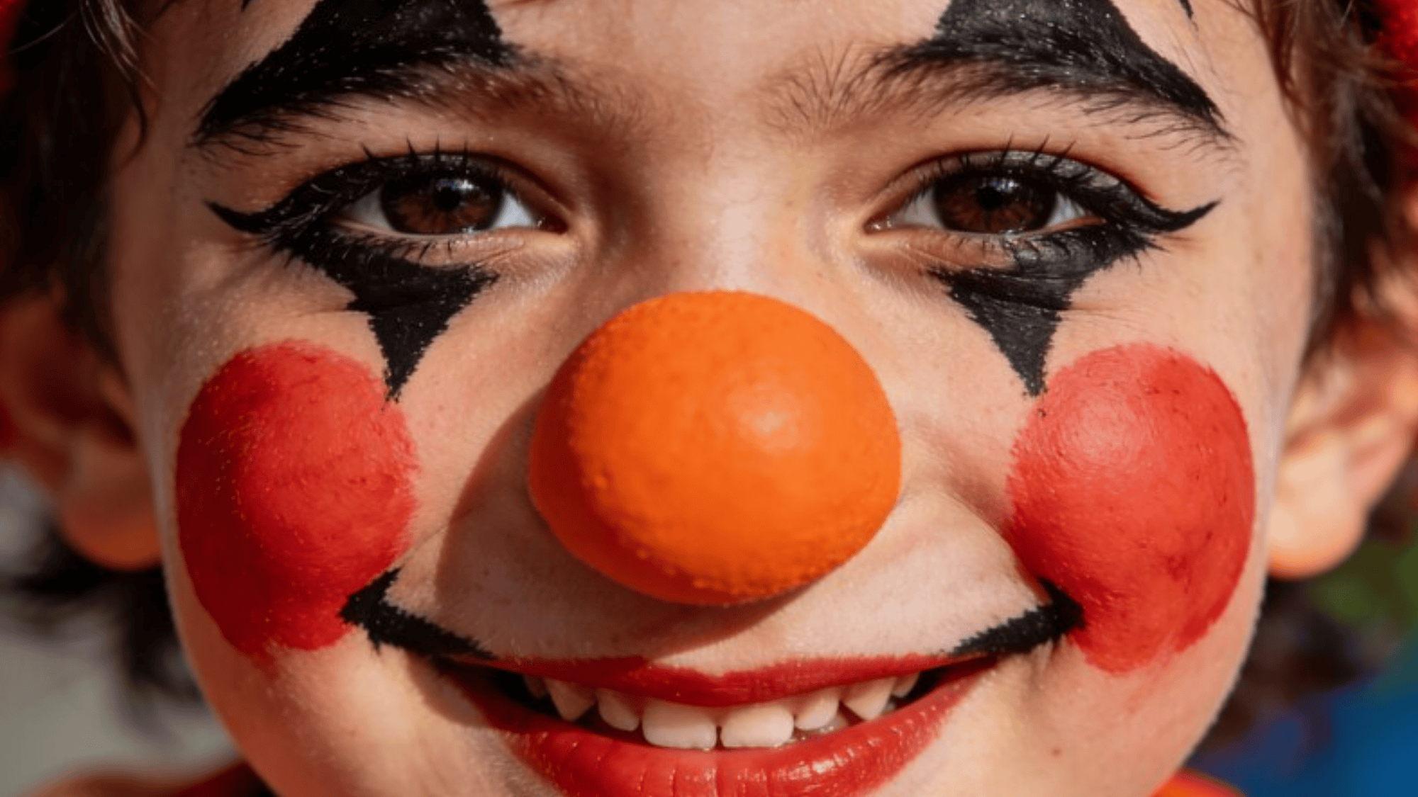 real child face painted as clown, vibrant colors on cheeks and nose, headshot only, no hands or props