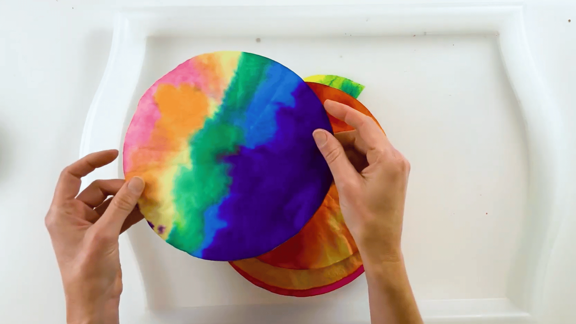setting painted coffee filters aside to dry completely after painting.