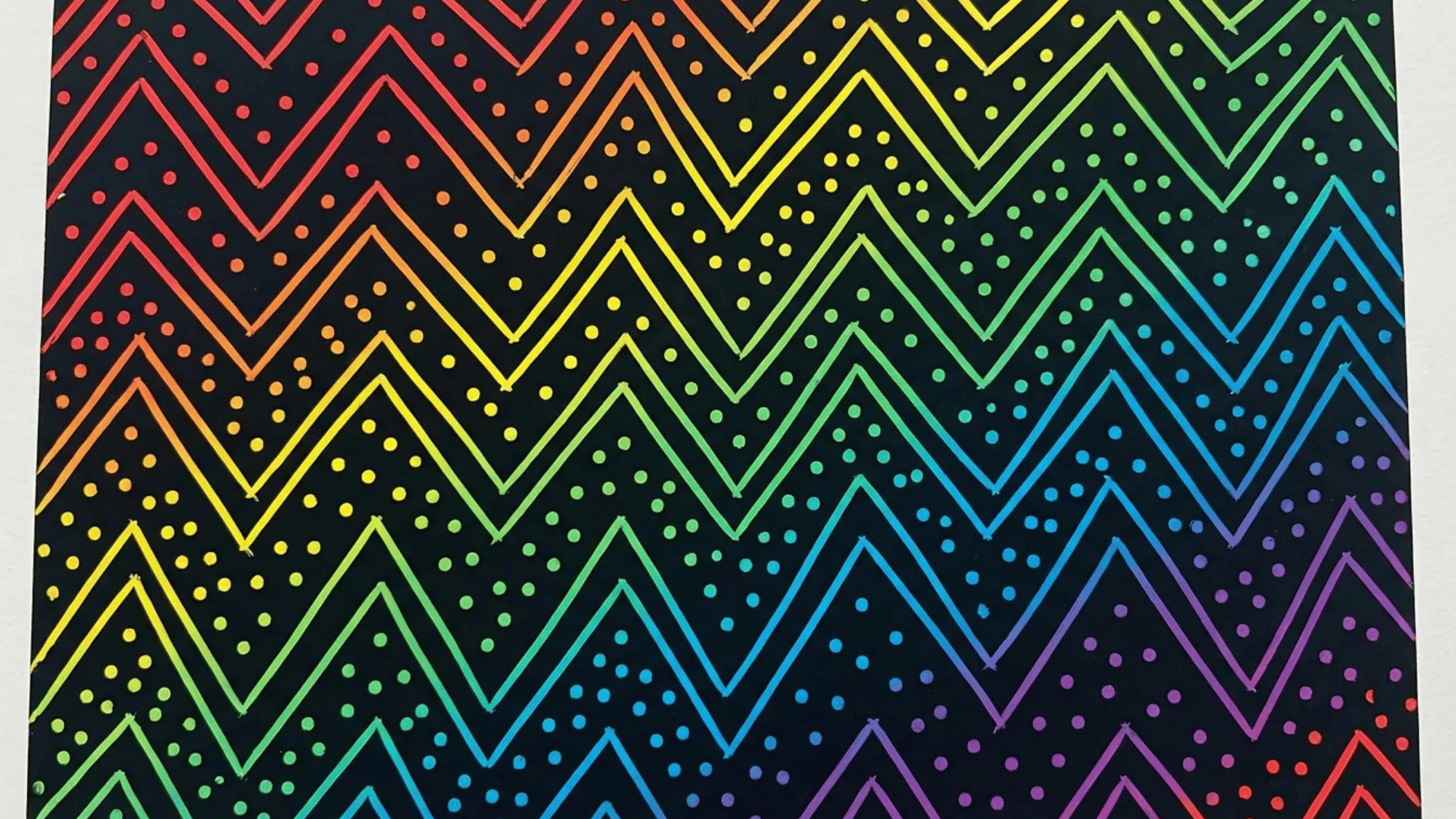 vibrant rainbow zigzag pattern with dotted lines on a black background